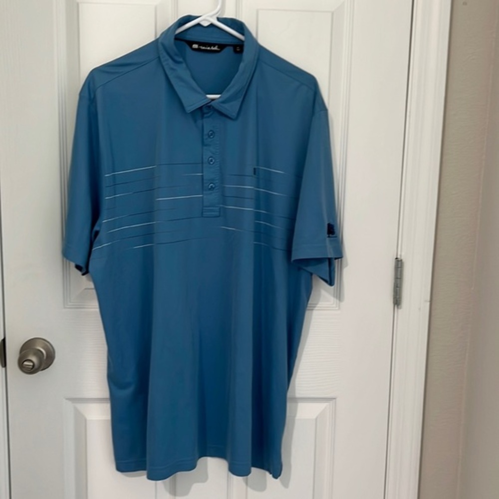 Travis Mathew mens 4 button blue polo shirt